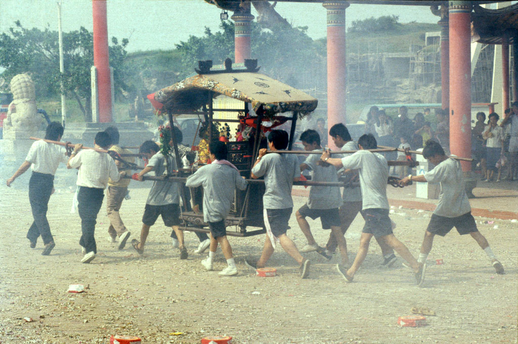 One of the sedan chairs with religious figures