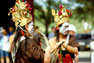 Men wearing masks at festival