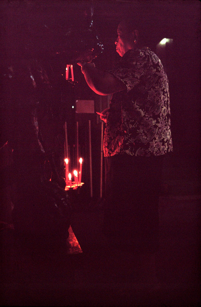 A woman prays in a temple
